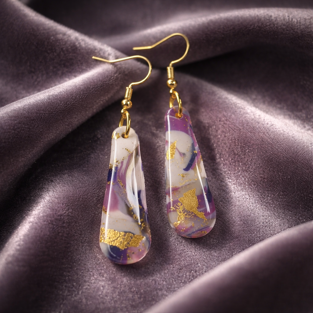 Handmade marbled drop earrings in purple and gold colors