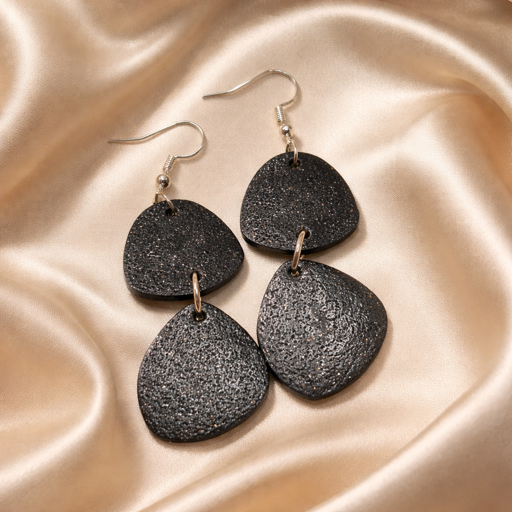 Handmade black dangle earrings with unique textures