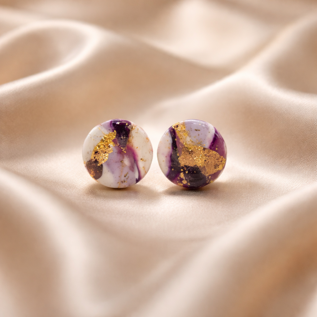 Round purple and white marbled stud earrings with gold flecks