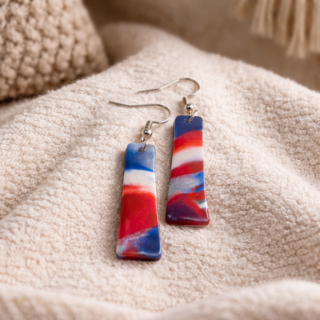Red, white, and blue striped rectangular dangle earrings with silver hooks.